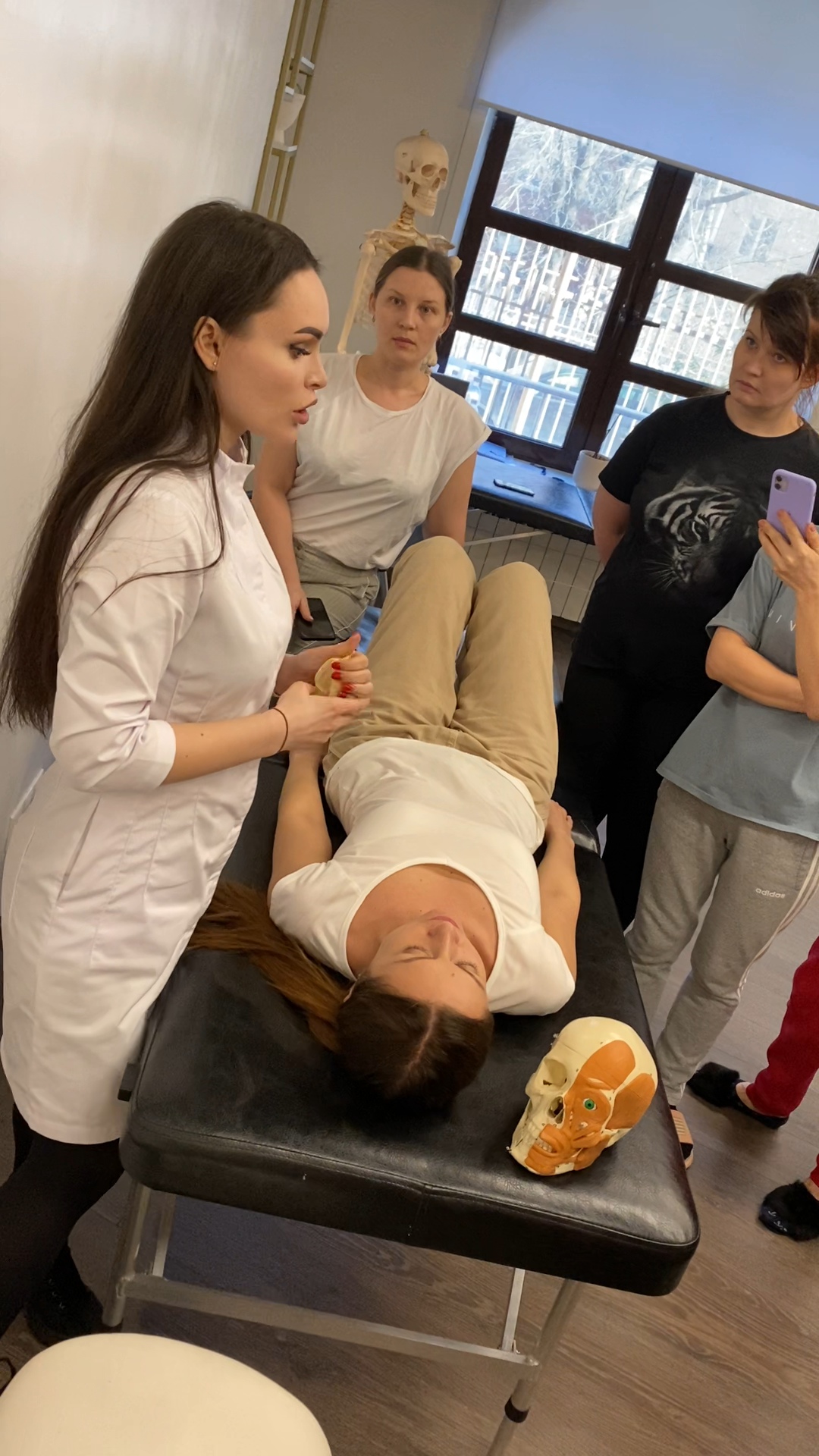 Victoria teaching osteopathic technique to students